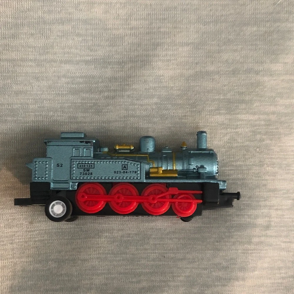 Blue and Red Toy Train with Gold Accents